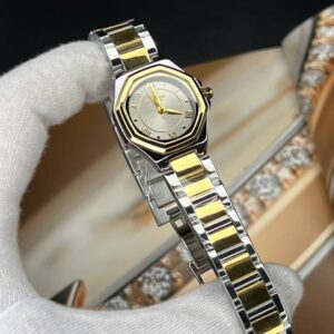 ساعت مچی زنانه رومنسون کلاسیک صفحه چند ظلعی طوسی بند استیل طلایی