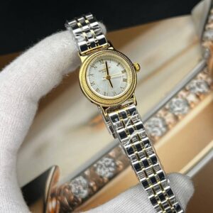 ساعت مچی زنانه رومنسون کلاسیک صفحه گرد طوسی قاب طلایی بند استیل