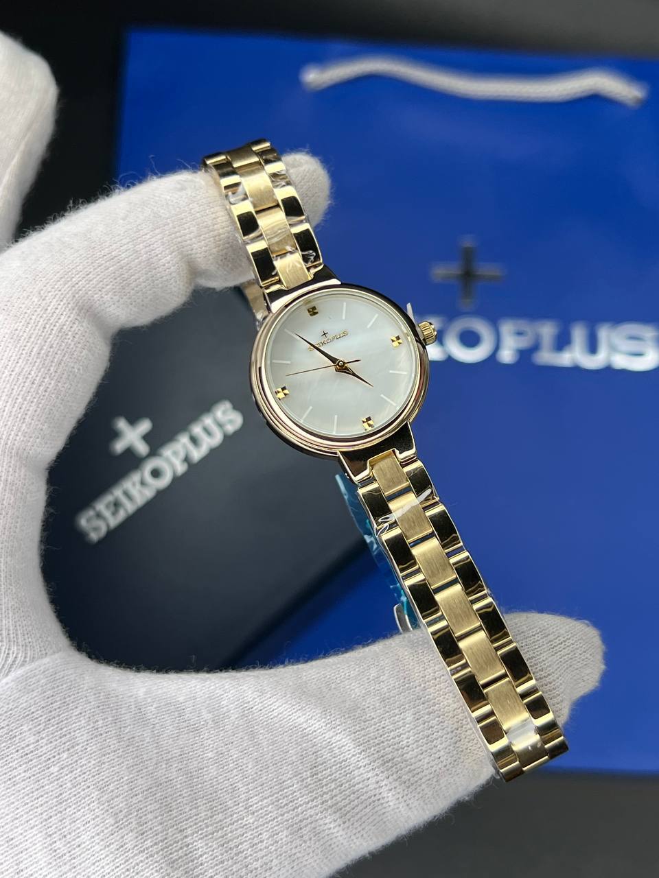 ساعت مچی زنانه سیکو پلاس SEIKO PLUS+ (17) ساعت مچی زنانه سیکو پلاس SEIKO PLUS+ صفحه سفید ساده بند طلایی
