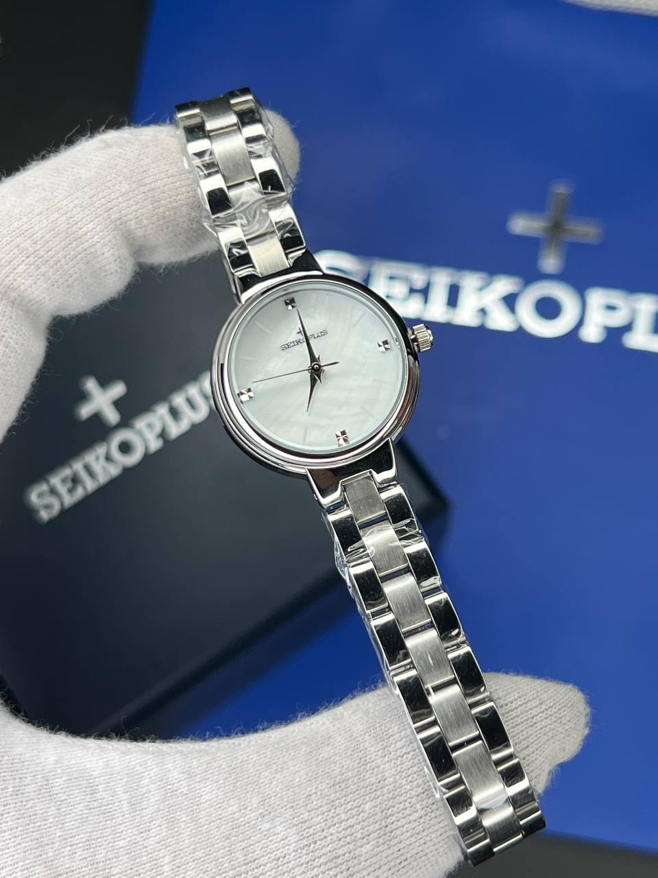 ساعت مچی زنانه سیکو پلاس SEIKO PLUS+ (27) ساعت مچی زنانه سیکو پلاس SEIKO PLUS+ صفحه سفید ساده بند استیل