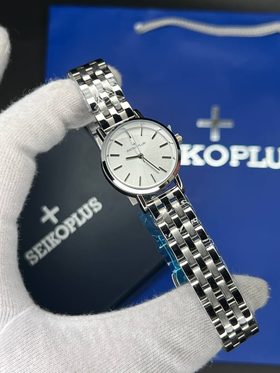 ساعت مچی زنانه سیکو پلاس SEIKO PLUS+ (4) ساعت مچی زنانه سیکو پلاس SEIKO PLUS+ صفحه سفید اندیس خطی بند استیل