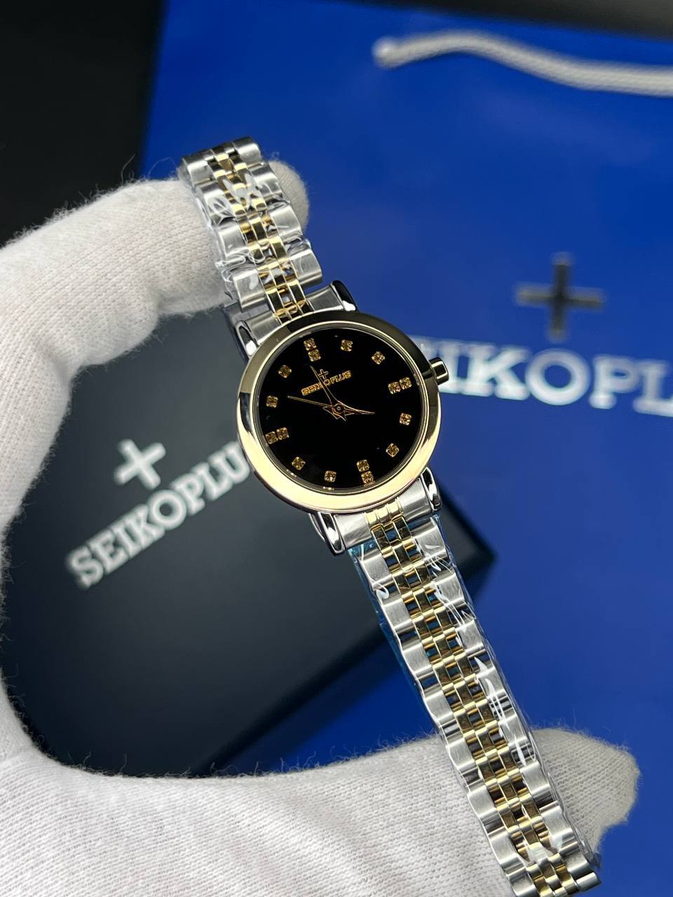 ساعت مچی زنانه سیکو پلاس SEIKO PLUS+ (40) ساعت مچی زنانه سیکو پلاس SEIKO PLUS+ صفحه مشکی نگین دار بند استیل طلایی