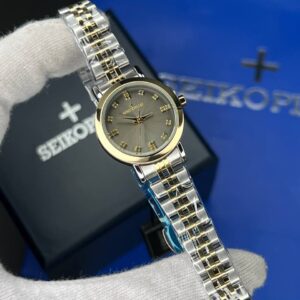 ساعت مچی زنانه سیکو پلاس SEIKO PLUS+ صفحه خاکستری نگین دار بند استیل طلایی