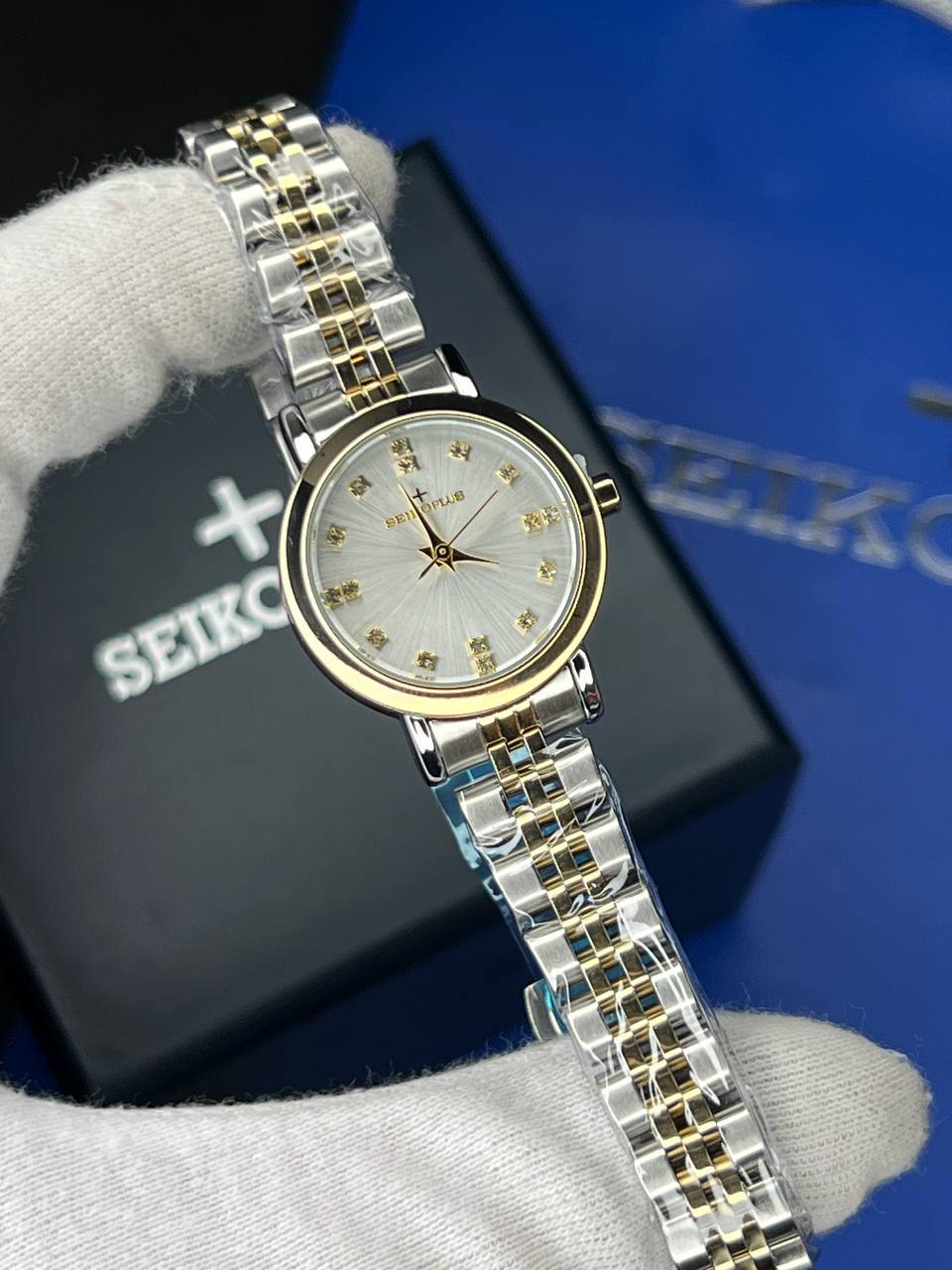 ساعت مچی زنانه سیکو پلاس SEIKO PLUS+ (43) ساعت مچی زنانه سیکو پلاس SEIKO PLUS+ صفحه طوسی نگین دار بند استیل طلایی