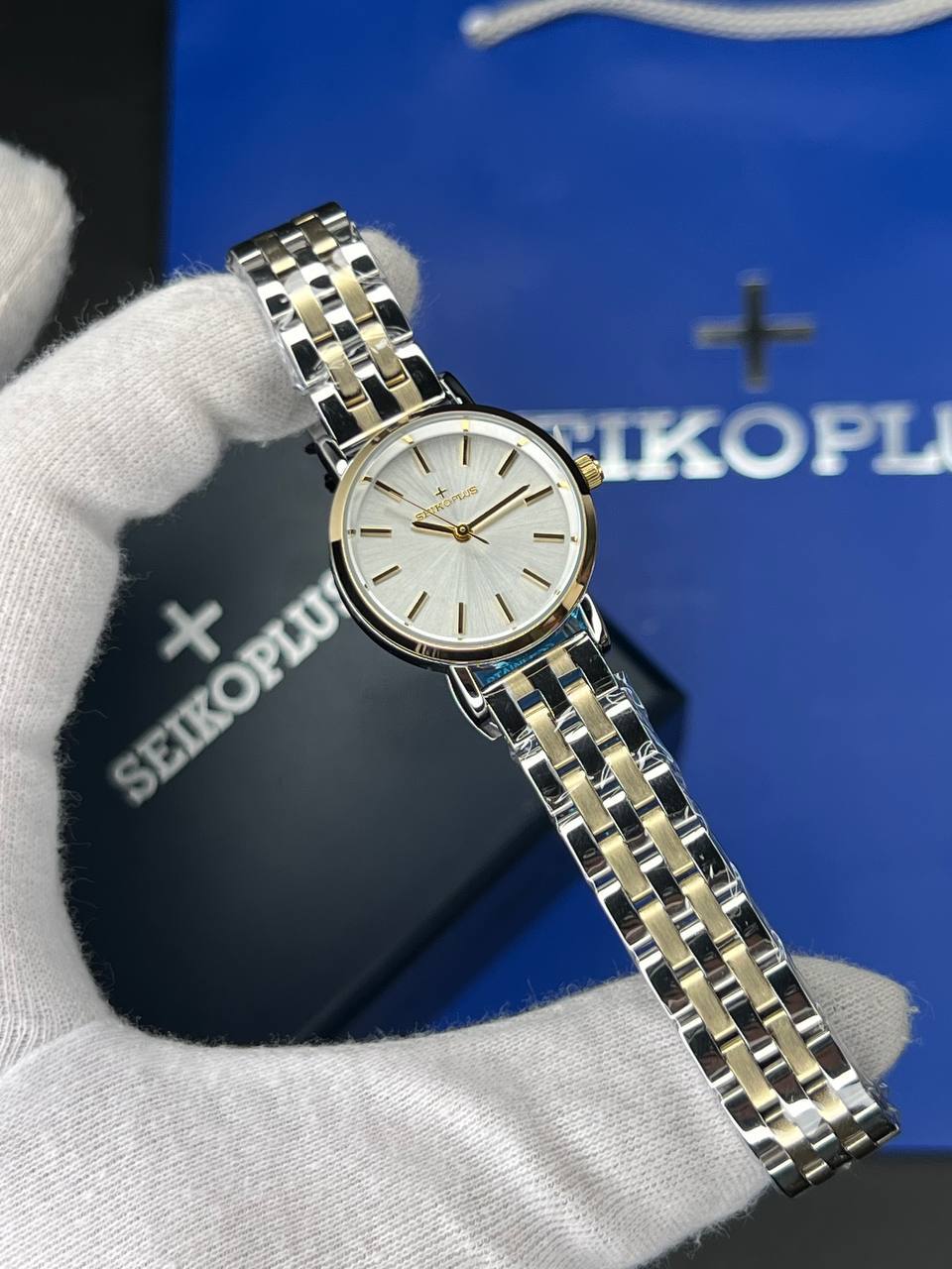 ساعت مچی زنانه سیکو پلاس SEIKO PLUS+ (5) ساعت مچی زنانه سیکو پلاس SEIKO PLUS+ صفحه صدفی اندیس خطی بند استیل طلایی